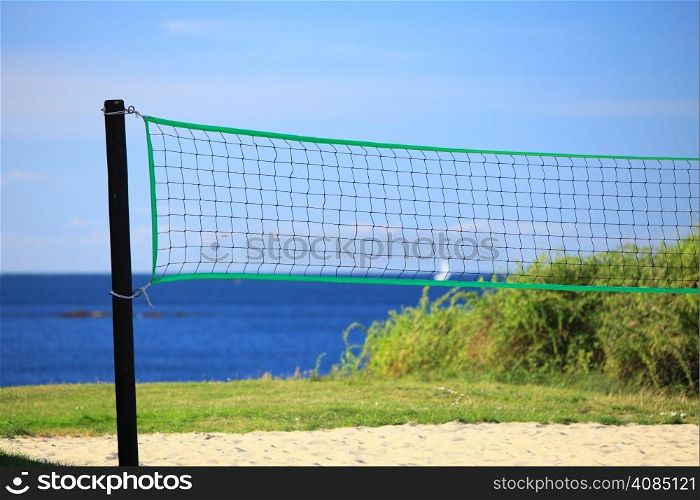 volleyball green net and playing court outdoor sea in the background. Sports concepts