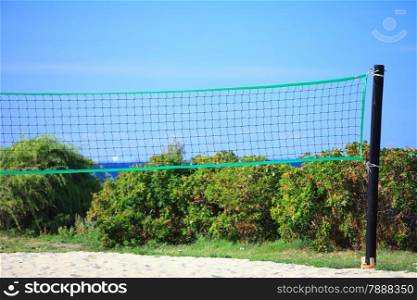 volleyball green net and playing court outdoor sea in the background. Sports concepts
