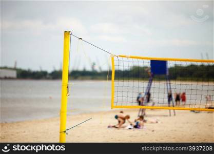 Volleyball summer sport equipment. Closeup of net netting wire on a sandy beach outdoor. Active lifestyle.