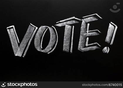Vote word written in chalk with a big exclamation mark on a blackboard