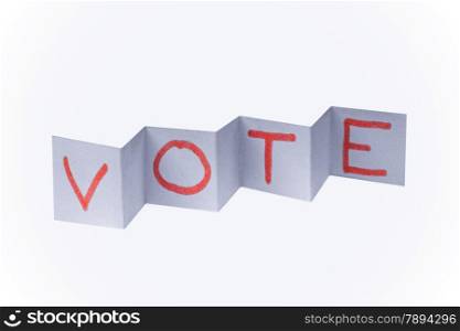 VOTE word written on paper