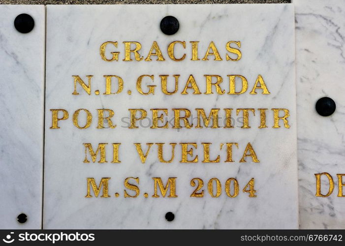 votive offerings or thanksgiving to Our Lady of the Guard of Marseille materialized by a marble plaque for a wish come true