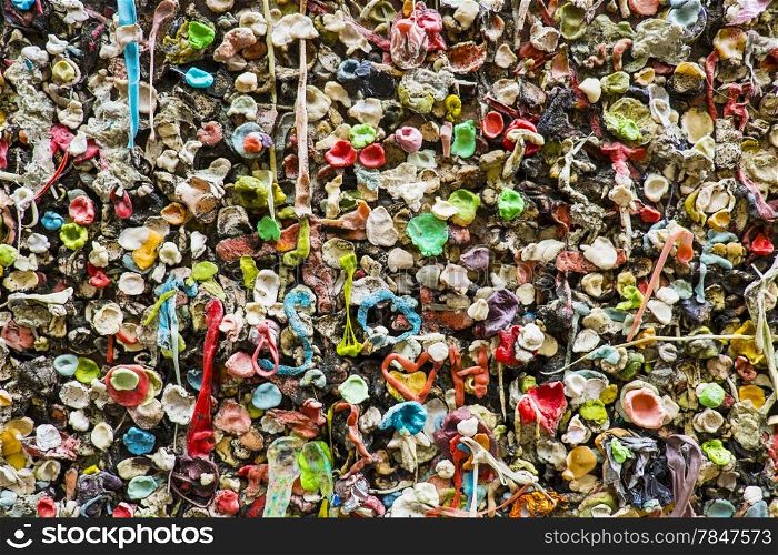 Wads of chewed bubble gum are stuck to the gum wall near the Pike Place Market in Seattle. The wall is a local landmark.
