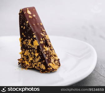Waffle cake in chocolate glaze isolated on white background