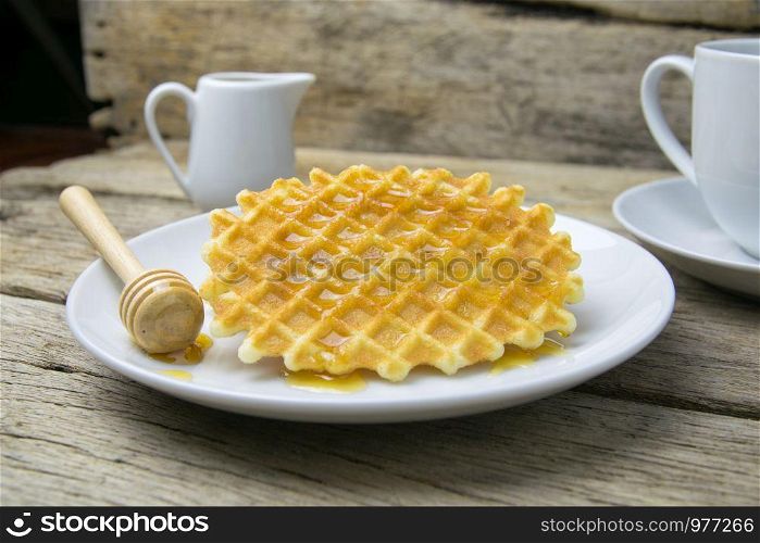 waffle with a cup of Coffee and honey