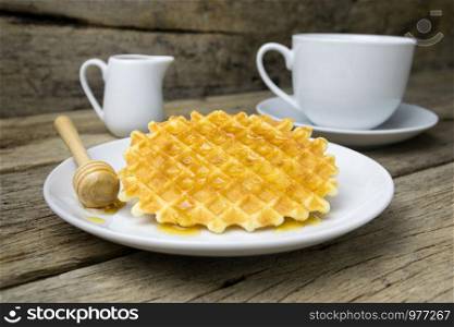 waffle with a cup of Coffee and honey