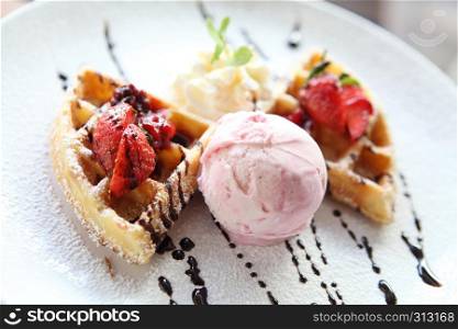 waffle with ice cream on wood background
