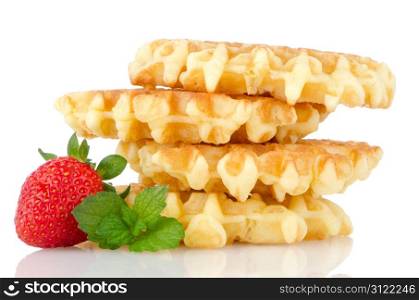 Waffles and strawberry isolated on white background.