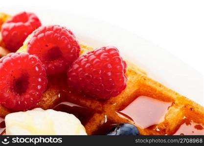 Waffles with mixed berries and syrup macro.