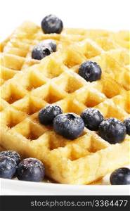 waffles with sugar covered blueberries and syrup. waffles with sugar covered blueberries and syrup on white background