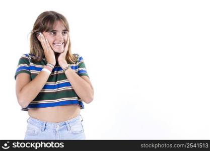 Waist up portrait of a happy attractive girl holding her hands on her neck, smiling and looking at the camera isolated over white background