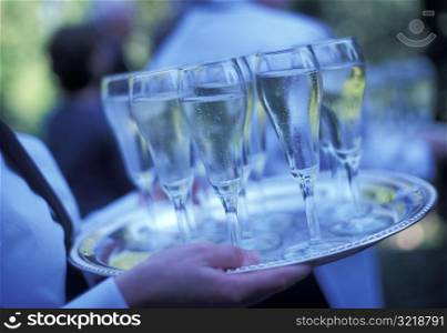 Waiter Carrying a Tray of Champagne Glasses