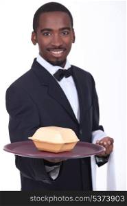 Waiter holding tray with fast food container