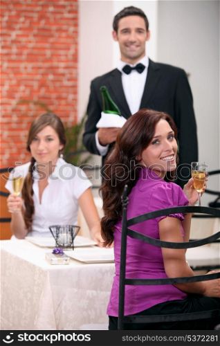 Waiter serving customers