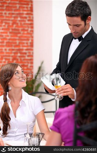 waiter serving wine
