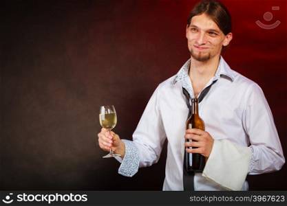 Waiter serving wine bottle.. Drink winery liquor relax concept. Waiter serving wine bottle. Steward holds glass with alcohol beverage.