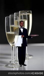 Waiter standing near champagne glasses