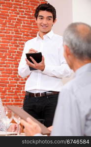 Waiter taking an order