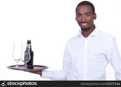 Waiter with beer on a tray