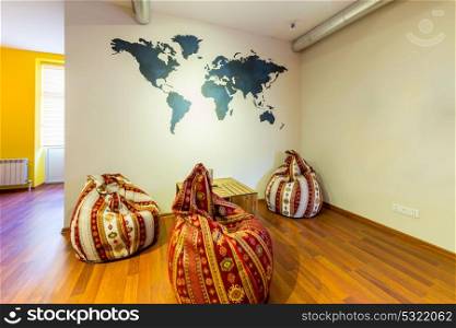 Waiting area in hotel with bean bag chairs