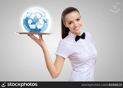 Waitress holding a tray with a symbol of green environment