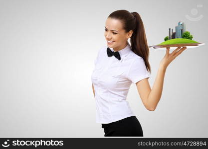 Waitress holding a tray with a symbol of green environment