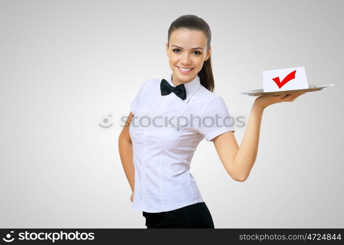 Waitress holding a tray with symbol of success on it