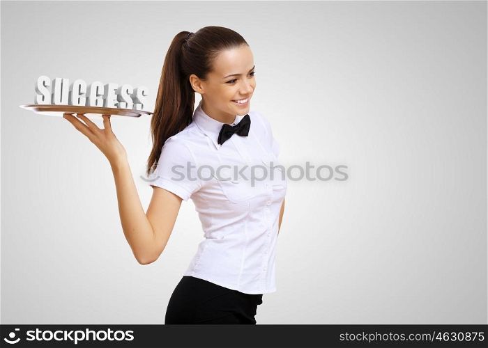Waitress holding a tray with word success on it