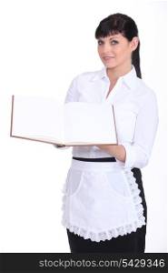 Waitress holding menu