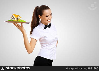 Waitress in white shirt with a tray and house on it