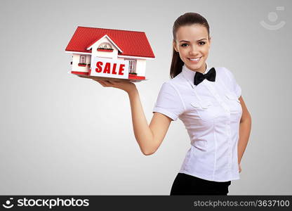 Waitress in white shirt with a tray and house on it