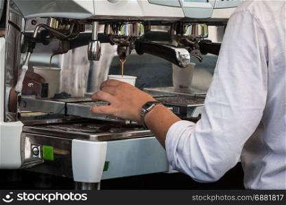 Waitress Preparing Espresso Coffee in Restaurant with Professional Coffee Machine