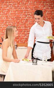 Waitress serving plate