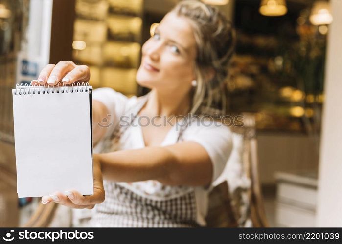 waitress showing notebook