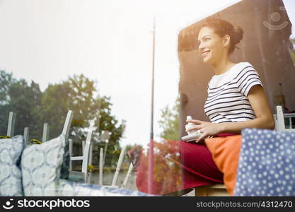 Waitress taking break in cafe