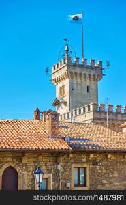 Waiving flag on the tower of the town hall (Palazzo Pubblico) of the City of San Marino, San Marino