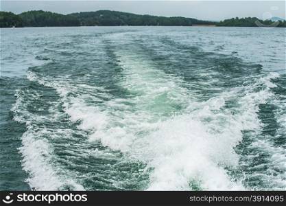 wake from a boat on lake