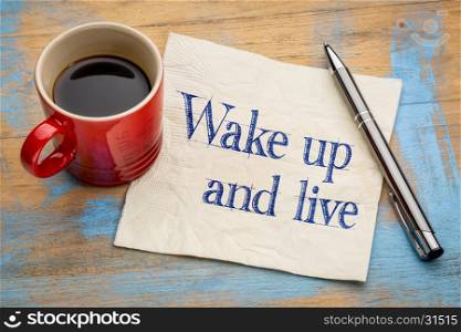 Wake up and live - handwriting on a napkin with a cup of espresso coffee