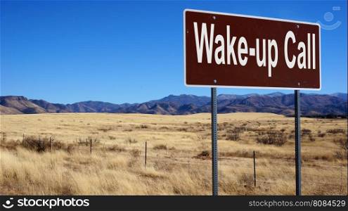 Wake up Call road sign with blue sky and wilderness