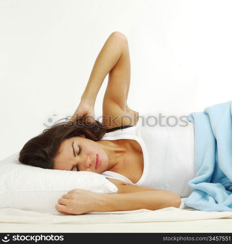 waking woman on the white pillow