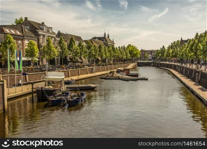 walk along a canal with boats and restaurants in the center of the city of Breda. netherlands europe