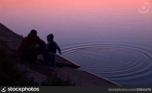 Walk along the lake shore at sunset