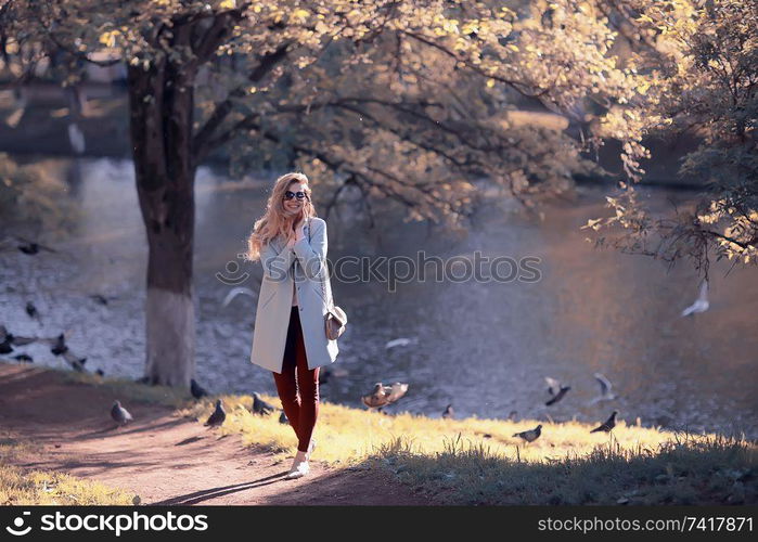 walk in autumn park / beautiful girl in autumn park, model female happiness and fun in yellow trees October