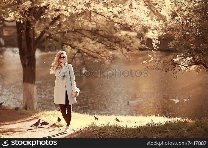 walk in autumn park / beautiful girl in autumn park, model female happiness and fun in yellow trees October