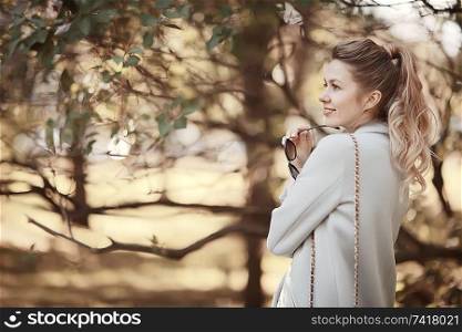 walk in autumn park / beautiful girl in autumn park, model female happiness and fun in yellow trees October