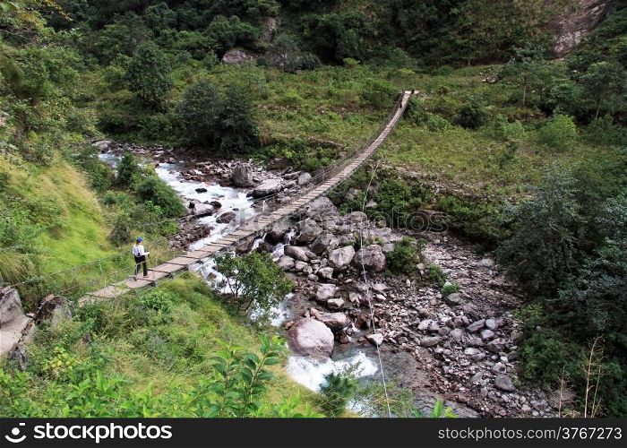 Walk on the suspension bridge in Nepal