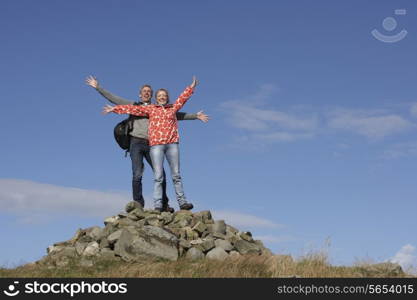 Walkers Standing On Pile Of Rocks