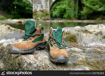 Walking boots by a river
