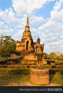 Walking Buddha statue in Sukhothai Historical Park