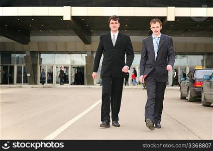 walking businessmen
